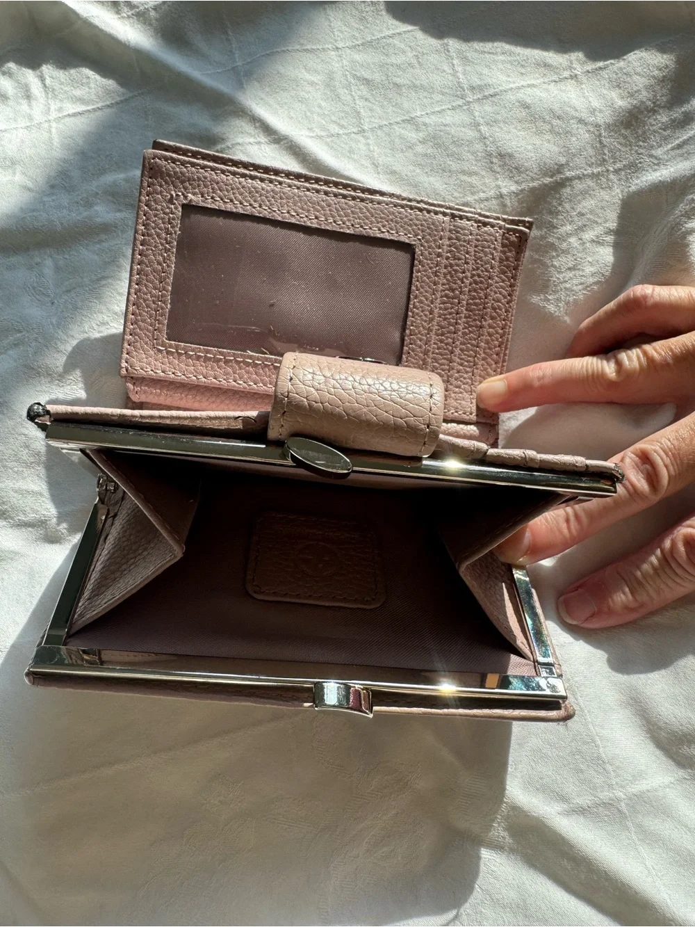 Pink pebbled leather Giani Bernini wallet featuring a snap-tab closure